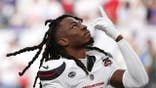 Calen Bullock prays before the Texans-Bills game at Reliant Stadium.