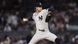 Cam Schlittler throws a pitch during a Yankees game at Yankee Stadium.