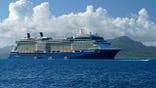 Celebrity Solstice cruise ship anchored in lagoon between Raiatea and Tahaa.