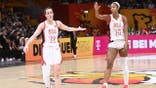 Caitlin Clark high fives Angel Reese during USA Basketball Women's National Team game.