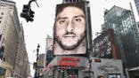 Colin Kaepernick Nike ad displayed on a wall in New York City.
