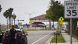 Tampa Police Department officers block traffic along South Dale Mabry Highway near MacDill Air Force Base.