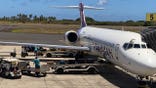 Ground crew unload baggage from a Hawaiian Airlines flight in Kauai.