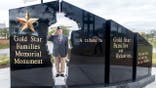 Hershel Woody Williams salutes at Gold Star Families Memorial Monument.