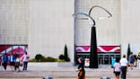 People walk past the Infinity sculpture outside the Smithsonian National Museum of American History on the National Mall.
