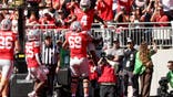 Jeremiah Smith celebrates a touchdown with Ian Moore during a college football game at Ohio Stadium.