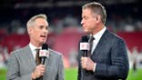 Joe Buck and Troy Aikman look on at Raymond James Stadium in Tampa.