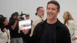 John Ternus holds up the iPhone Duo.