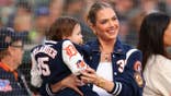 Kate Upton smiles with her daughter Bellamy Verlander at Comerica Park.