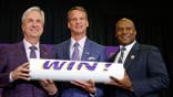 Lane Kiffin poses with LSU President Dr. Wade Rousse and interim athletic director Verge Ausberry at a press conference.