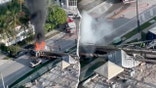 Four people were taken to the hospital Monday after a construction rig toppled onto three vehicles and a construction container in Miami, trapping two workers and igniting a vehicle fire, authorities said.