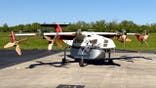 A pilotless cargo plane sits on a runway.