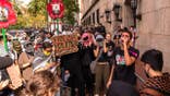 People attend a vigil and protest outside Columbia University on Oct. 7, 2025.
