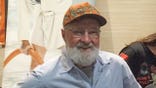 Randy Quaid wears a hat
