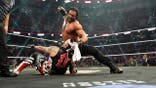 Roman Reigns wrestles Penta in the ring at Arena Ciudad de Mexico.