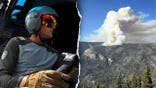 Ryan Cutter flying a helicopter split with a fire at Yosemite.