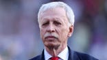 Stan Kroenke stands during a Premier League match at Selhurst Park.