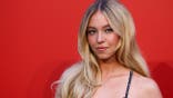 Sydney Sweeney poses during a photocall at the Armani Beauty dinner in Venice.