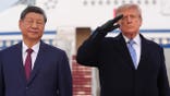 President Donald Trump and Xi Jinping stand together at an arrival ceremony.