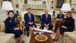 Xi Jinping and Peng Liyuan sit with President Trump and Melania Trump in the Oval Office.