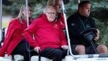 warren buffet in a golf cart