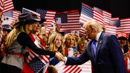 President Donald Trump greets attendees as he walks on stage on the first day of the Republican National Convention at the American Airlines Center in Dallas, Texas, on Sept. 9, 2026. Trump headlined the Republican National Committee's first-ever midterm convention as he aimed to highlight his administration's achievements and rally support for GOP candidates ahead of the November elections.