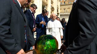 Pope Leo XIV receives 'symbolic’ sphere in charity's push for AI to 'protect human dignity'