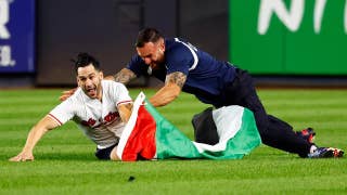 Yankee stadium security tackle field invader waving Palestinian flag during 9/11 anniversary game