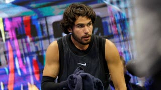 Tennis star Carlos Alcaraz vomits in towel during US Open thriller after trying to shoo cameras away