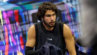 Tennis star Carlos Alcaraz vomits in towel during US Open thriller after trying to shoo cameras away - Fox News