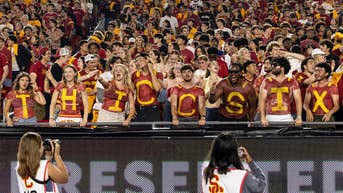 Trojans win but a fight between fans in the stands steals some of the spotlight - Fox News