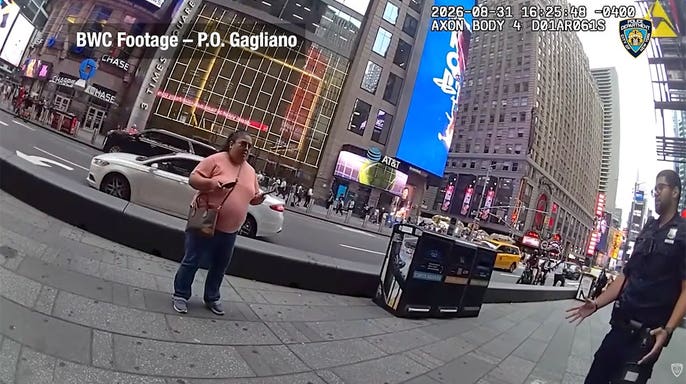 NYPD body camera image shows officers confronting a woman armed with two knives in Times Square moments before police opened fire. Is this conversation helpful so far?