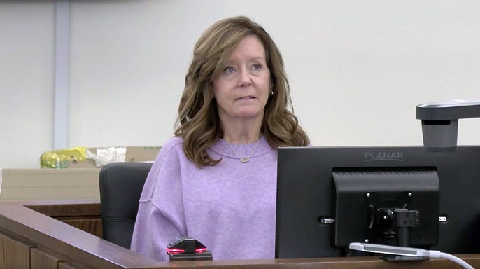 Jill Smith, the mother of Ashley Flynn, testifies from the witness stand during Caleb Flynn’s murder trial in Ohio.
