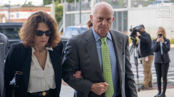 Rob and Kathy Kirk arrive at a Utah courthouse for a hearing in the murder case against Tyler Robinson.