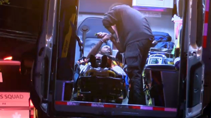 Elijah Hemingway loaded into an ambulance 