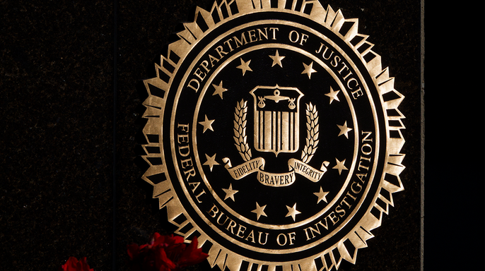 The seal of the Federal Bureau of Investigation (FBI), part of the U.S. Department of Justice, is displayed at the J. Edgar Hoover Building on August 8, 2026 in Washington, DC.