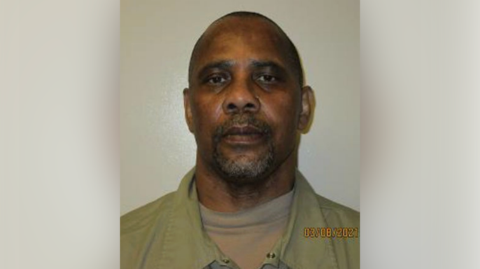 2021 mugshot of Merle Wakefield wearing a green shirt