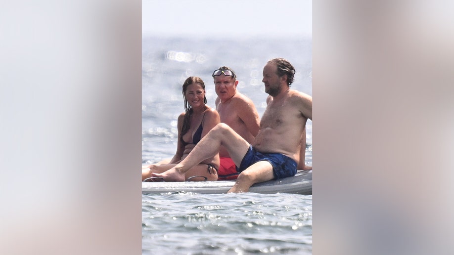 Simon Le Bon and Yasmin Le Bon on a boat with their friends.