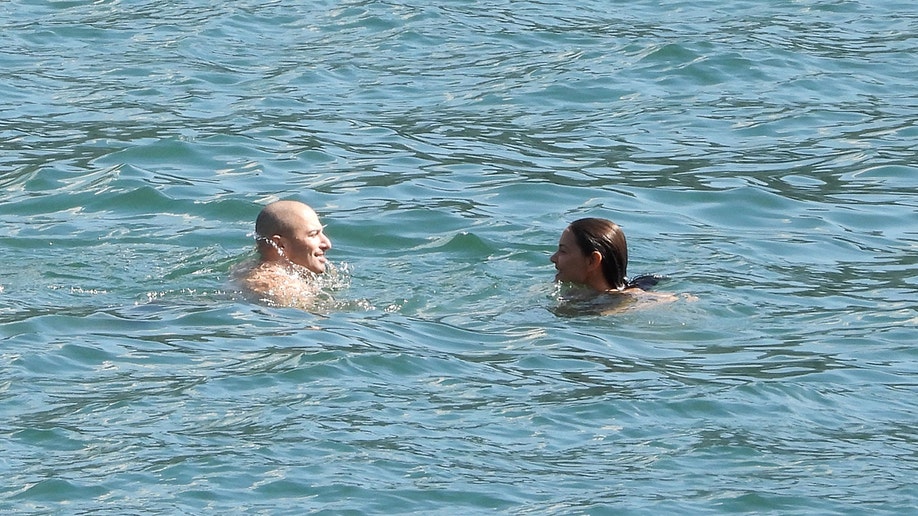 Jason Bard Yarmosky and Katie Holmes swimming in Lake Como.