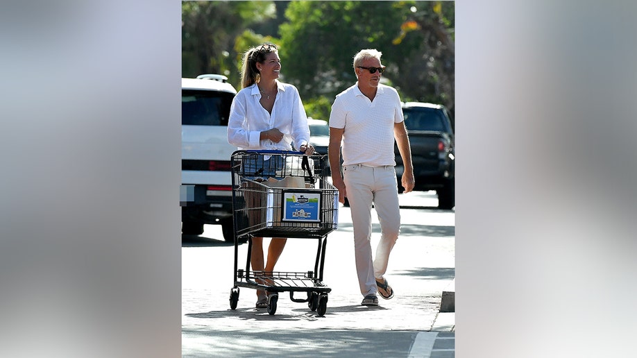 Costner and Milburn were photographed shopping in Santa Barbara.