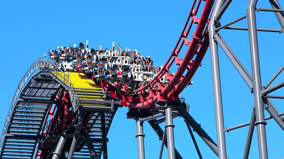 Close-up of people on X2 roller coaster