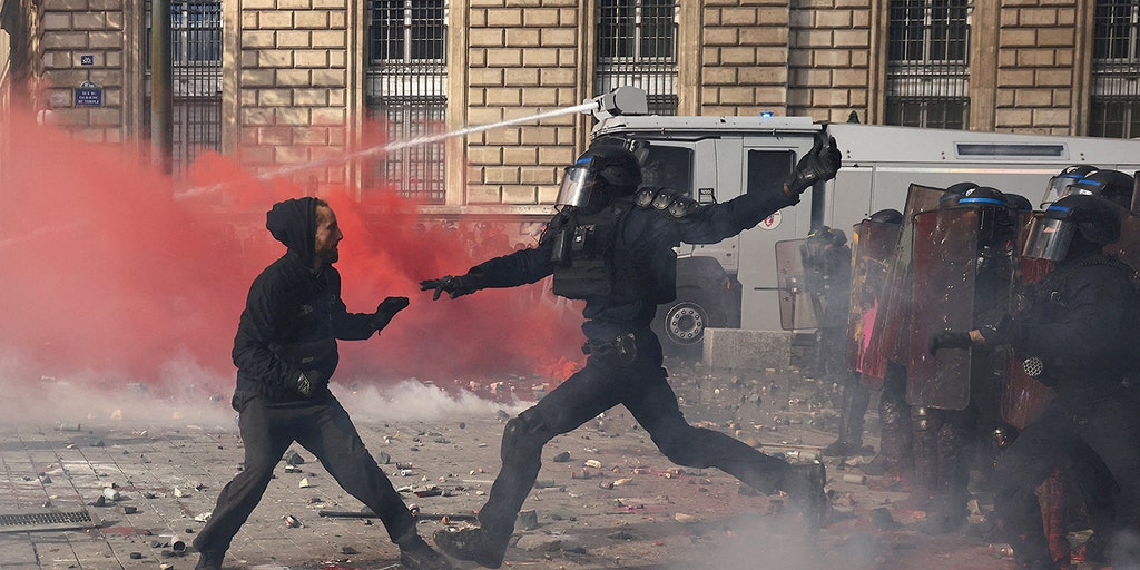 Violence erupts at France protests as Macron warns unrest is being exploited