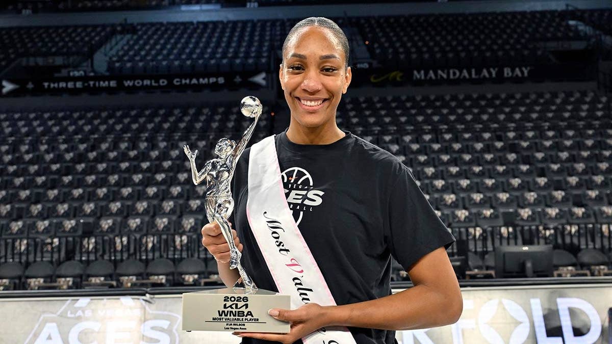 A'ja Wilson holds her fifth WNBA MVP award at Michelob ULTRA Arena.