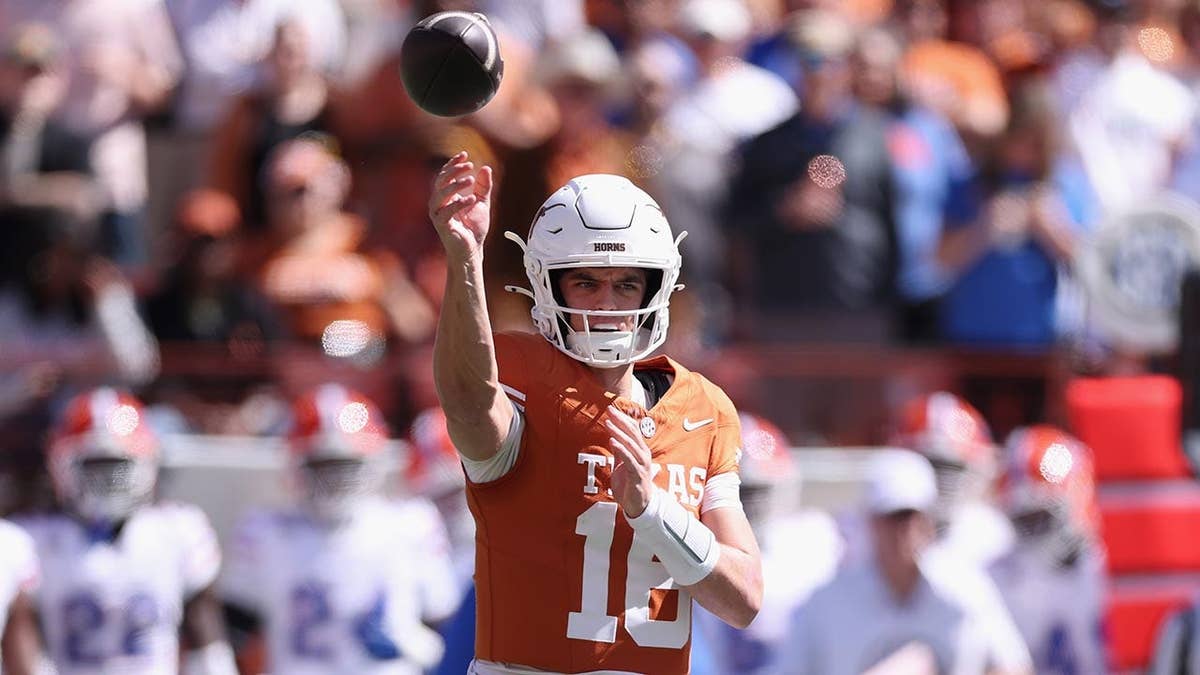 Arch Manning throws a pass during a college football game