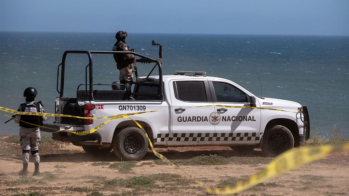National Guard vehicles guard a state prosecutors investigative search at the site where three surfers were camping before disappearing during a surf trip, as the investigation continues in El Faro, Santo Tomas delegation in Ensenada, Baja California state, Mexico, on May 6, 2024. Baja California State Prosecution Office confirmed the deaths of Australian brothers Jake and Callum Robinson and their American friend Jack Carte on May 5, 2024.