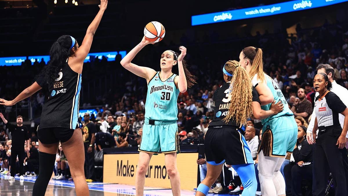 Breanna Stewart looks to pass the ball during a WNBA game in Atlanta.