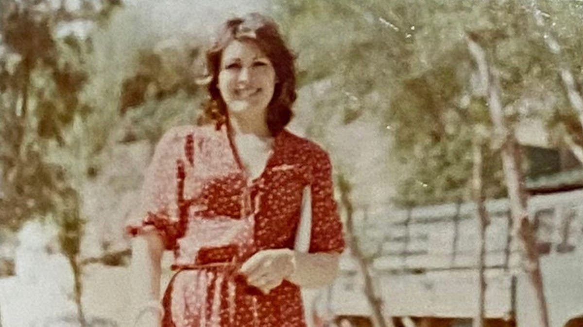 Cathy Mahone wearing a red dress in Jordan.