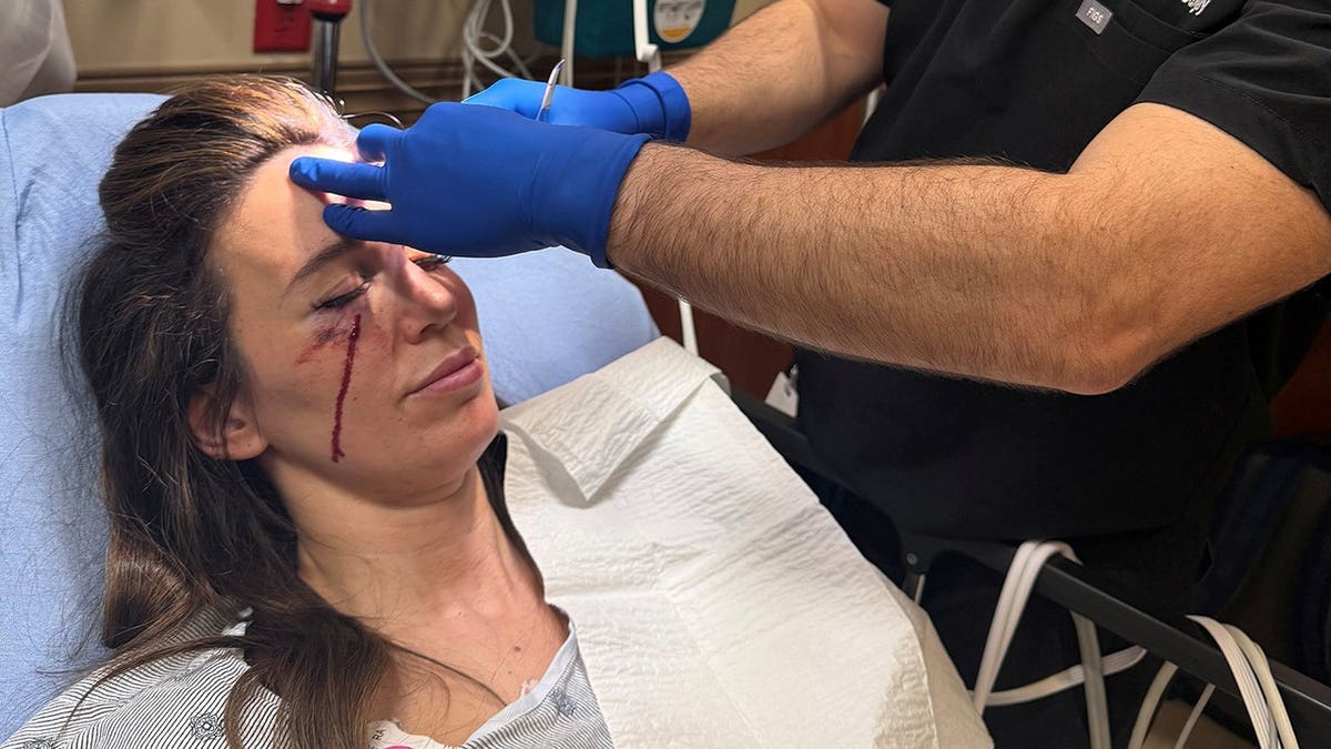 Christy Carlson Romano being treated at the hospital after getting shot.