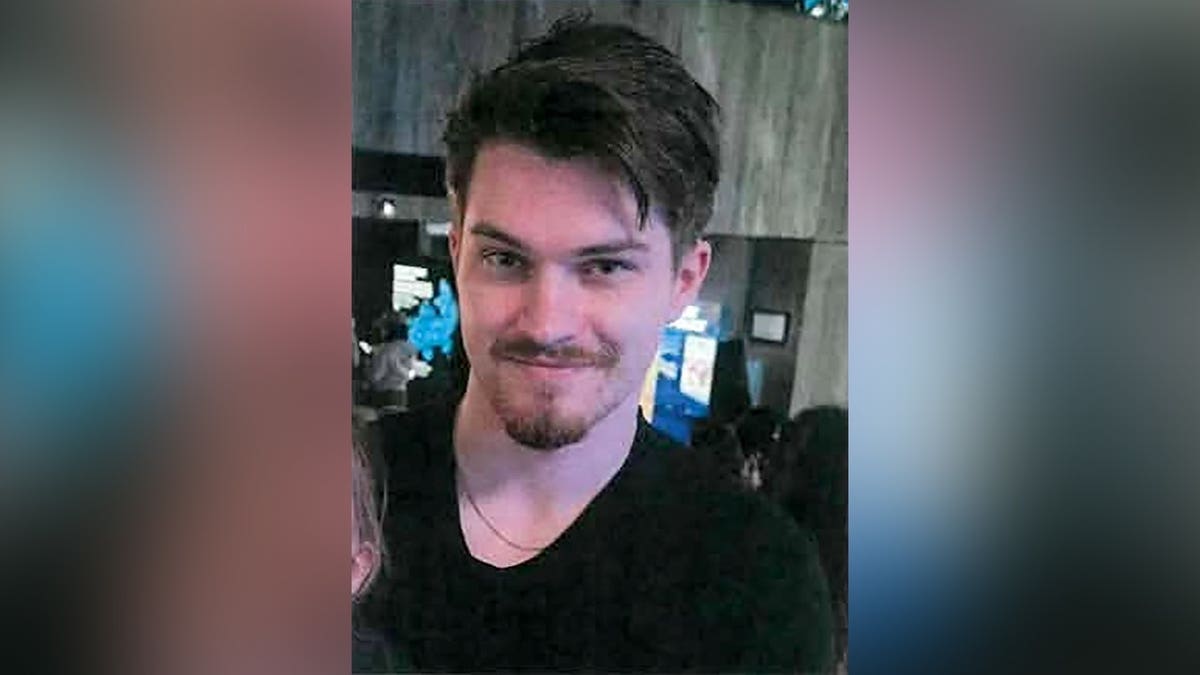 Close-up photo of missing 24-year-old Phoenix Phillips wearing a black shirt.