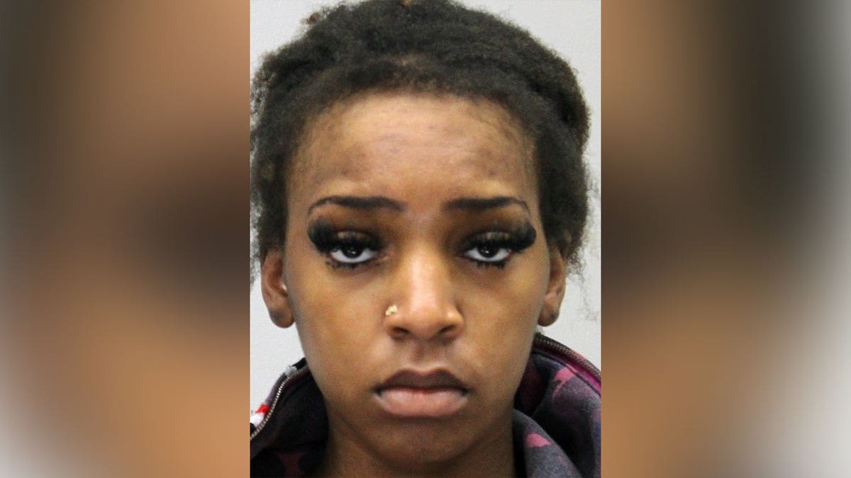 Booking photo of Aldrea Rogers, 22, who faces two manslaughter charges following a fatal crash in Dallas.